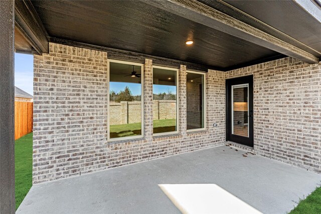 view of patio featuring ceiling fan