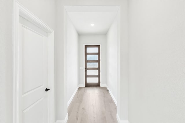 doorway with light hardwood / wood-style floors