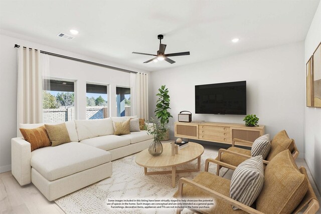 spare room featuring ceiling fan and light hardwood / wood-style flooring