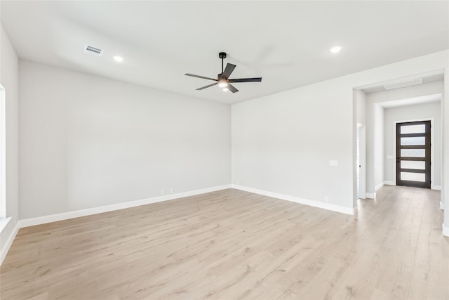 unfurnished room featuring light wood-type flooring and ceiling fan