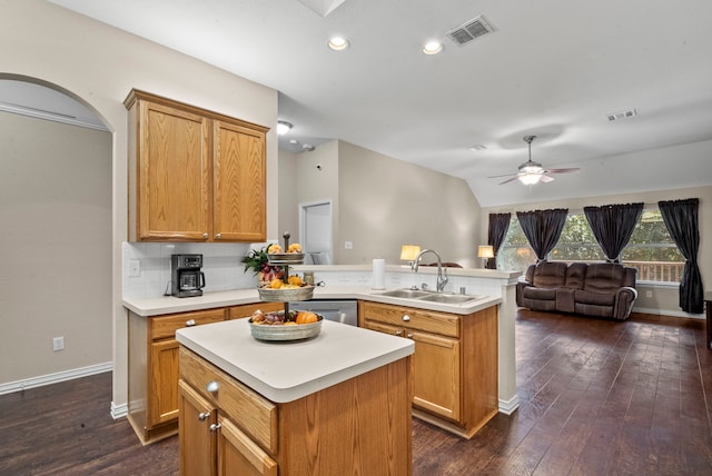 kitchen with a center island, dark hardwood / wood-style floors, sink, kitchen peninsula, and dishwasher