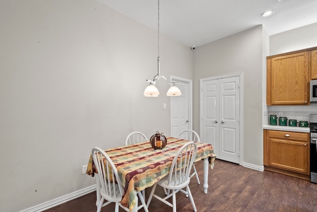 dining room featuring dark hardwood / wood-style flooring