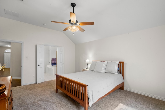 carpeted bedroom featuring ceiling fan, connected bathroom, and vaulted ceiling