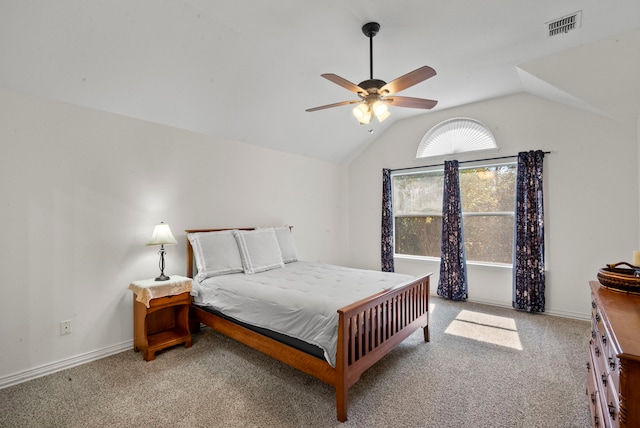 carpeted bedroom with vaulted ceiling and ceiling fan