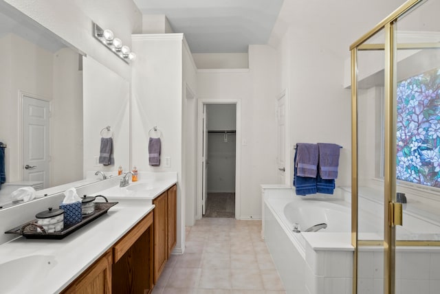 bathroom with tile patterned flooring, separate shower and tub, vanity, and a healthy amount of sunlight