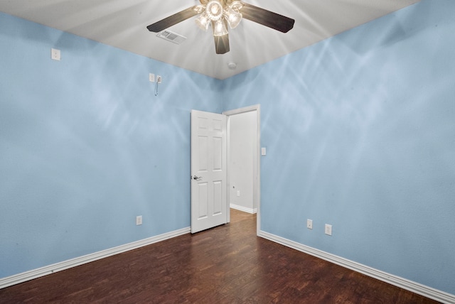 unfurnished room with ceiling fan and dark hardwood / wood-style floors