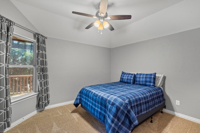 carpeted bedroom featuring ceiling fan and vaulted ceiling