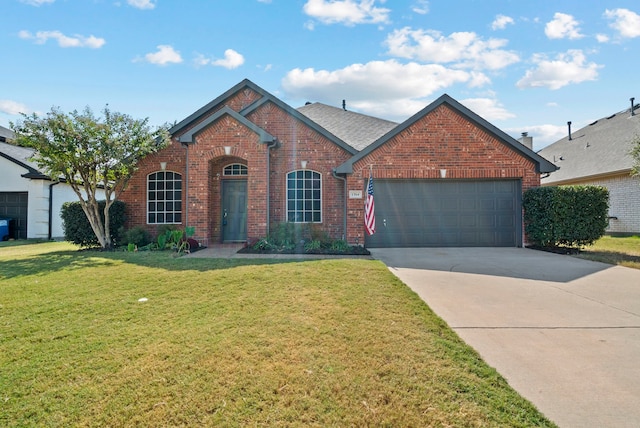 front of property featuring a front yard and a garage