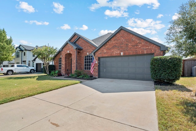 front facade with a front yard and a garage