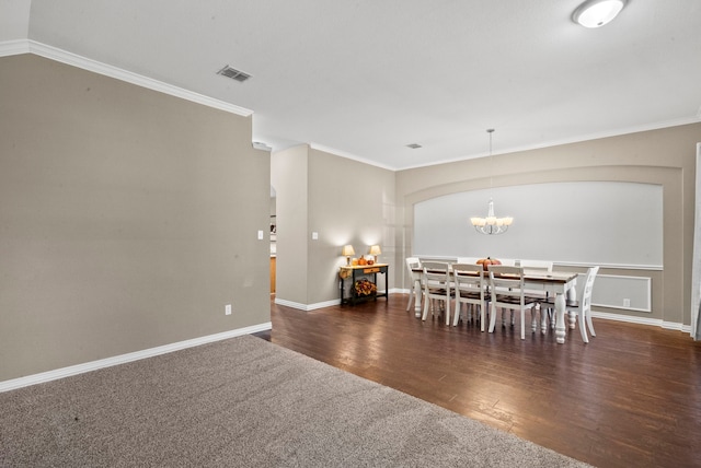 unfurnished dining area with ornamental molding, an inviting chandelier, and dark wood-type flooring