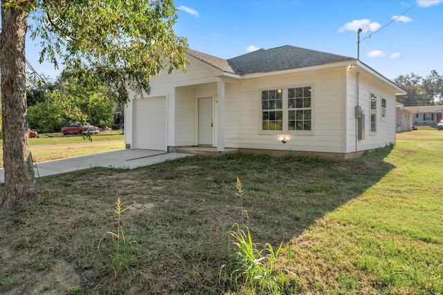 ranch-style home with a front yard and a garage