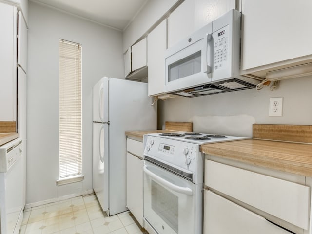 kitchen with white appliances and white cabinetry