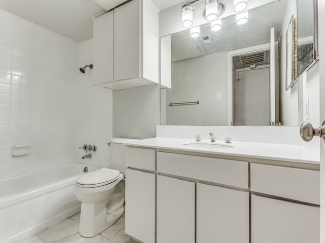 full bathroom featuring tiled shower / bath combo, vanity, and toilet