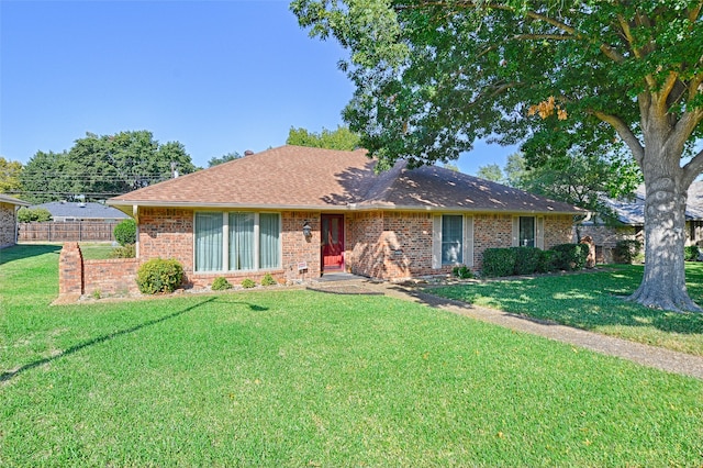 single story home featuring a front yard