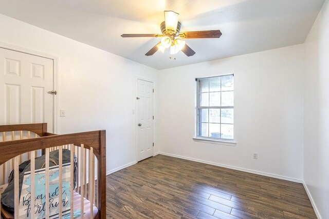 bathroom with toilet, shower / bath combination, wood finished floors, and vanity