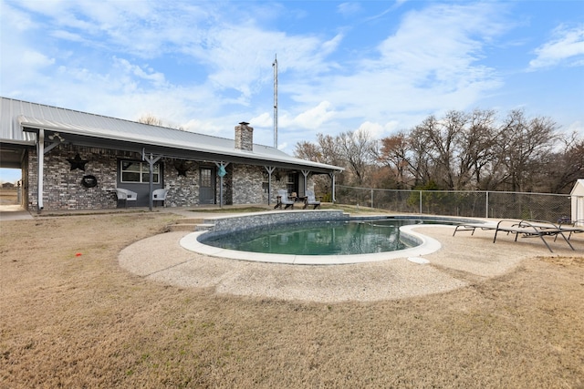 view of swimming pool with a fenced in pool, a patio, and fence