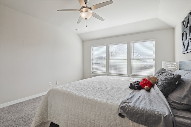 bedroom with vaulted ceiling, carpet floors, and ceiling fan