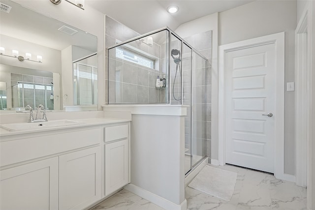 bathroom with a shower with door and vanity