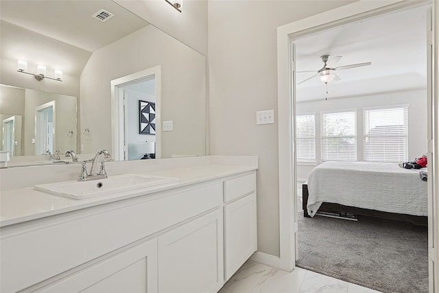 bathroom featuring vanity and ceiling fan