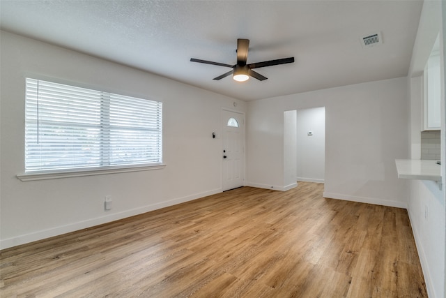 interior space featuring ceiling fan and light wood-type flooring