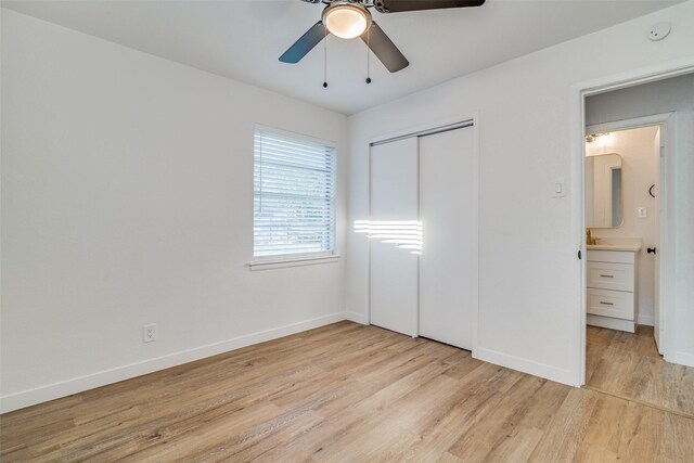 4713 San Marcus Dr, Mesquite, TX 75150 - unfurnished bedroom featuring light wood-style floors, a closet, baseboards, and ceiling fan