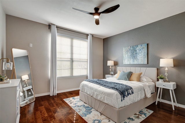 bedroom with dark wood-type flooring and ceiling fan