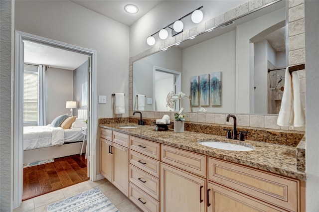 bathroom featuring vanity and wood-type flooring