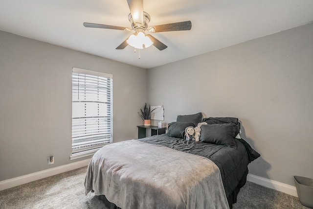 bedroom featuring dark colored carpet and ceiling fan