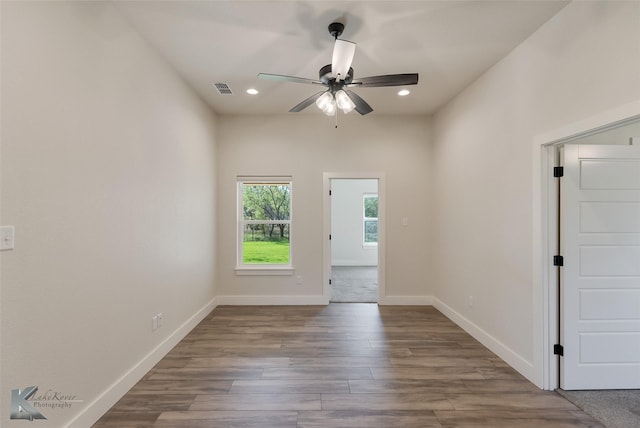 unfurnished room featuring ceiling fan and light wood-type flooring