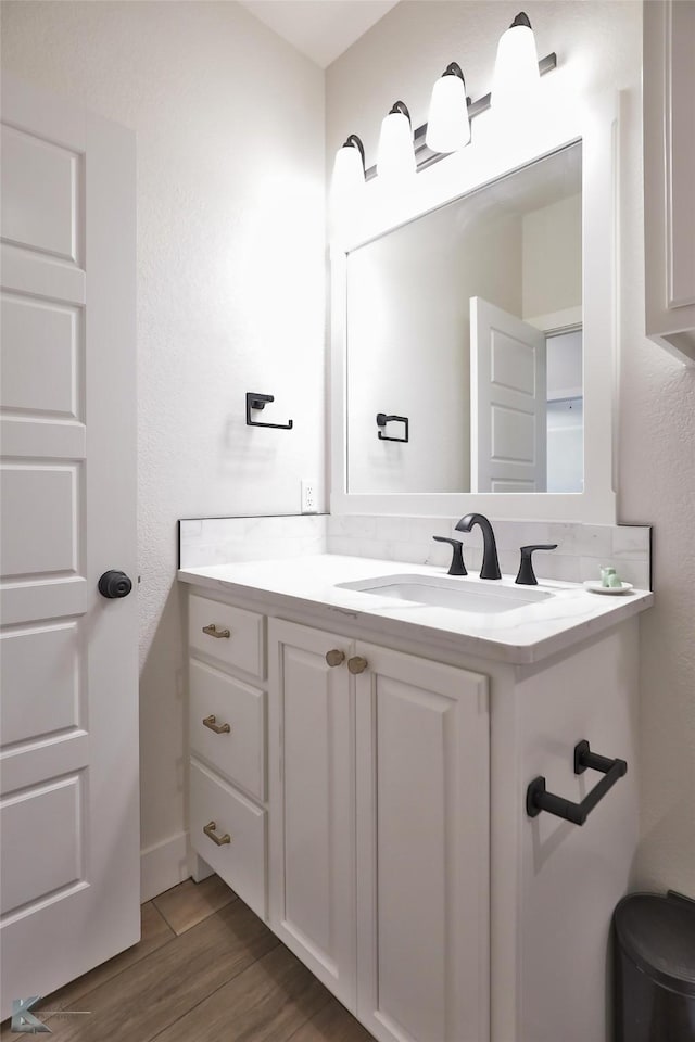 bathroom featuring vanity and hardwood / wood-style flooring