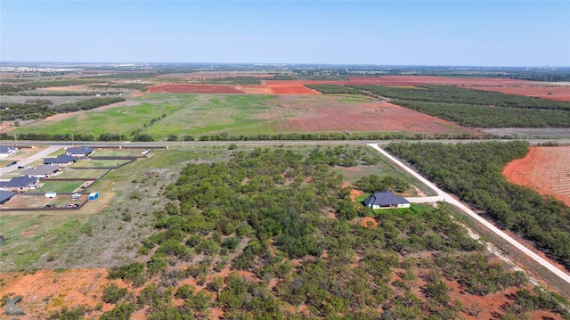 birds eye view of property with a rural view