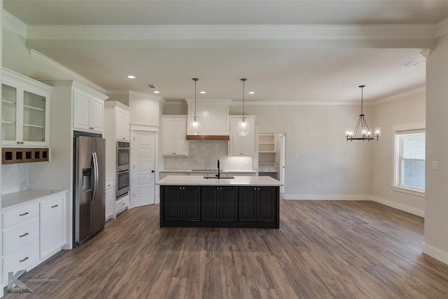 kitchen with white cabinetry, sink, crown molding, a center island with sink, and appliances with stainless steel finishes