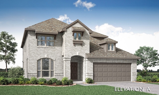 view of front of property with a front lawn and a garage