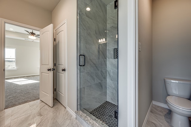 bathroom featuring walk in shower, ceiling fan, and toilet