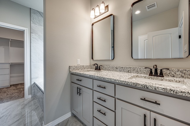 bathroom featuring vanity and a bathing tub