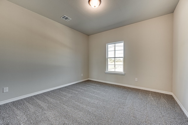 unfurnished room with carpet floors