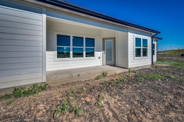 rear view of property featuring a patio