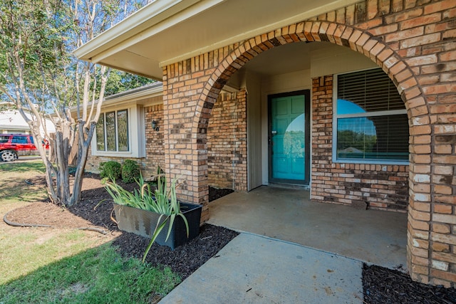 entrance to property with a patio area