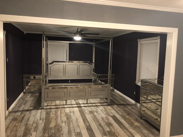 interior space with ornamental molding and dark wood-type flooring