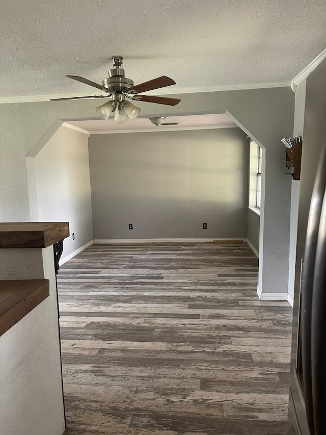 bonus room featuring a textured ceiling, ceiling fan, and dark hardwood / wood-style flooring