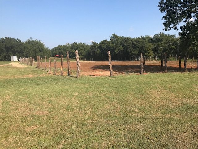 view of yard with a rural view