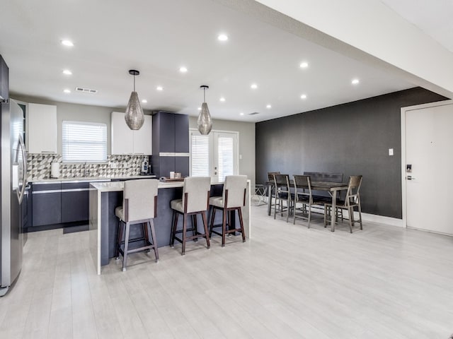 living room with light hardwood / wood-style flooring