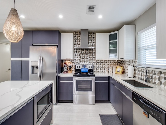 kitchen with light hardwood / wood-style flooring, a center island, stainless steel fridge with ice dispenser, pendant lighting, and decorative backsplash