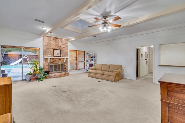 living room featuring ceiling fan, light colored carpet, beam ceiling, and a brick fireplace