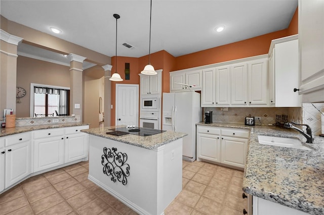 kitchen with white cabinetry, sink, white appliances, and a kitchen island