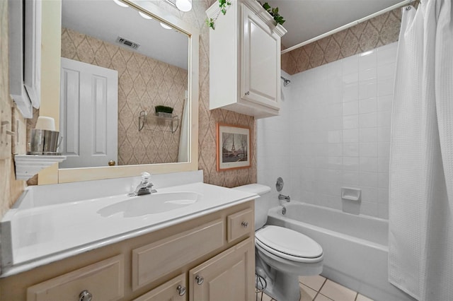 full bathroom with shower / tub combo with curtain, vanity, tile patterned floors, and toilet