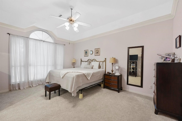 carpeted bedroom with crown molding, ceiling fan, and lofted ceiling