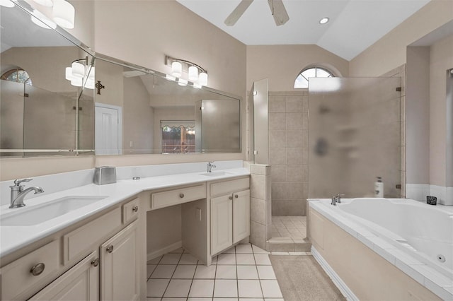 bathroom featuring vaulted ceiling, vanity, independent shower and bath, ceiling fan, and tile patterned flooring