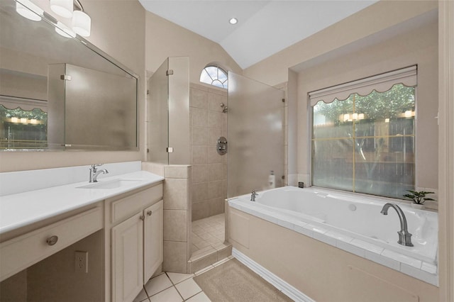 bathroom featuring tile patterned flooring, vanity, lofted ceiling, and independent shower and bath