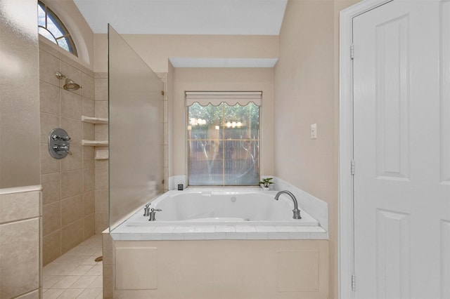 bathroom featuring tile patterned flooring and plus walk in shower